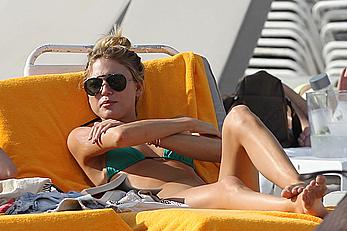 Martha Hunt sunbathing in bikini at the beach in Miami