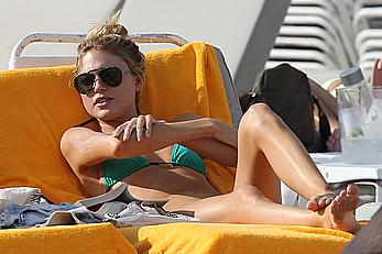 Martha Hunt sunbathing in bikini at the beach in Miami