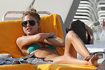 Martha Hunt sunbathing in bikini at the beach in Miami