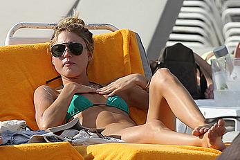 Martha Hunt sunbathing in bikini at the beach in Miami