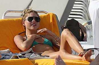 Martha Hunt sunbathing in bikini at the beach in Miami