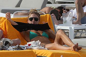 Martha Hunt sunbathing in bikini at the beach in Miami