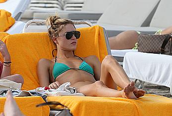 Martha Hunt sunbathing in bikini at the beach in Miami