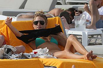 Martha Hunt sunbathing in bikini at the beach in Miami