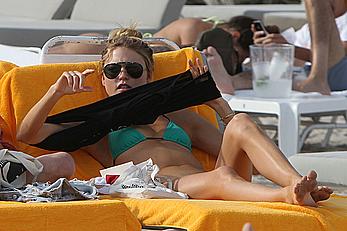 Martha Hunt sunbathing in bikini at the beach in Miami