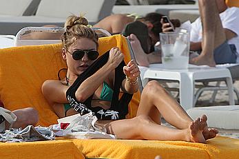 Martha Hunt sunbathing in bikini at the beach in Miami