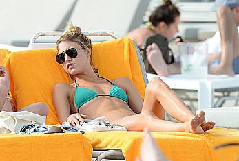 Martha Hunt sunbathing in bikini at the beach in Miami