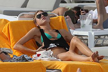 Martha Hunt sunbathing in bikini at the beach in Miami