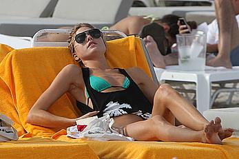 Martha Hunt sunbathing in bikini at the beach in Miami