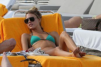 Martha Hunt sunbathing in bikini at the beach in Miami