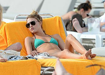 Martha Hunt sunbathing in bikini at the beach in Miami