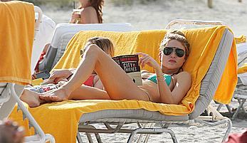 Martha Hunt sunbathing in bikini at the beach in Miami