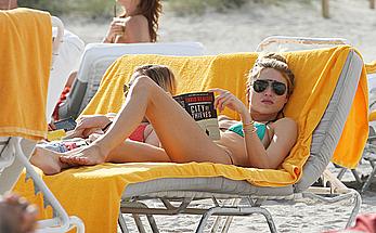 Martha Hunt sunbathing in bikini at the beach in Miami