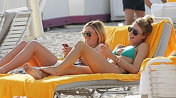 Martha Hunt sunbathing in bikini at the beach in Miami