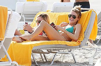 Martha Hunt sunbathing in bikini at the beach in Miami