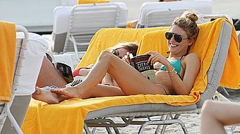 Martha Hunt sunbathing in bikini at the beach in Miami