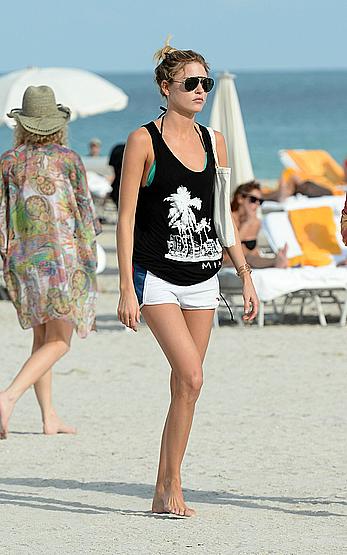 Martha Hunt sunbathing in bikini at the beach in Miami