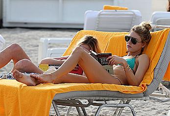 Martha Hunt sunbathing in bikini at the beach in Miami