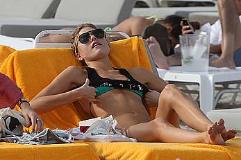 Martha Hunt sunbathing in bikini at the beach in Miami