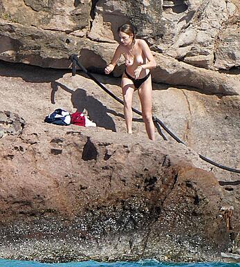 Maya Hawke topless on a beach at St. Barts with her mom Uma Thurman