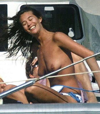 Megan Gale sunbathing topless on a yacht