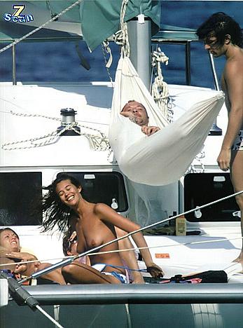 Megan Gale sunbathing topless on a yacht