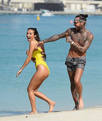 Megan McKenna in yellow bikini on a beach in Dubai