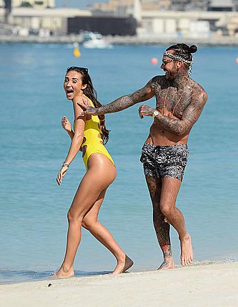 Megan McKenna in yellow bikini on a beach in Dubai