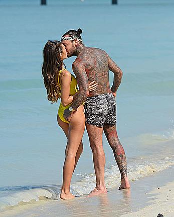 Megan McKenna in yellow bikini on a beach in Dubai