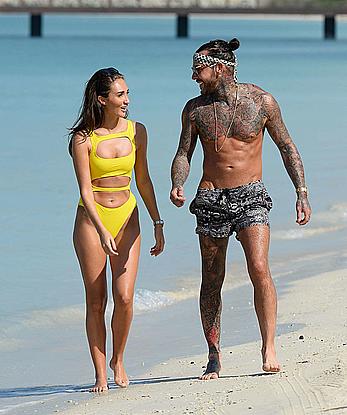 Megan McKenna in yellow bikini on a beach in Dubai