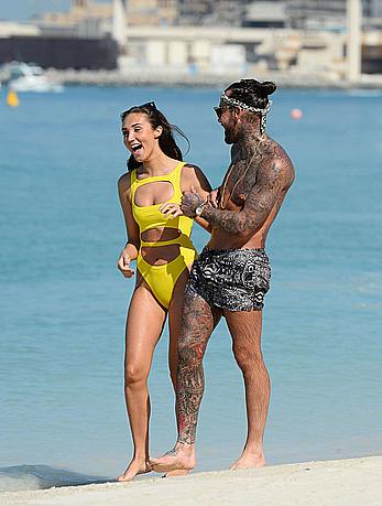 Megan McKenna in yellow bikini on a beach in Dubai