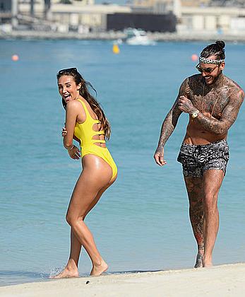 Megan McKenna in yellow bikini on a beach in Dubai