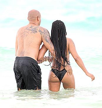 Melanie Brown in bikini candids on the beach in Mexico