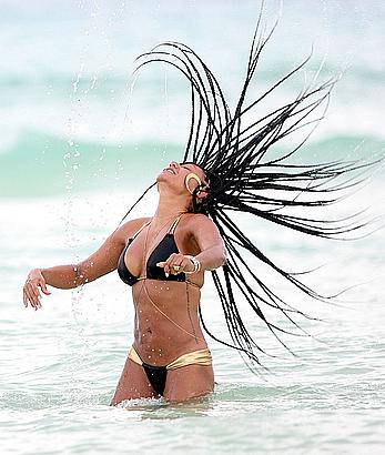 Melanie Brown in bikini candids on the beach in Mexico