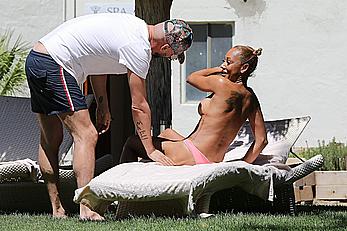 Melanie Brown topless at a resort in California