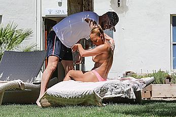 Melanie Brown topless at a resort in California