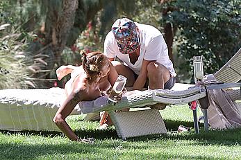 Melanie Brown topless at a resort in California