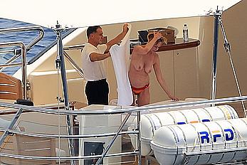 Melanie Griffith topless goes for a massage aboard a Yatch in Ibiza