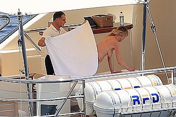 Melanie Griffith topless goes for a massage aboard a Yatch in Ibiza