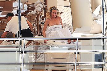 Melanie Griffith topless goes for a massage aboard a Yatch in Ibiza