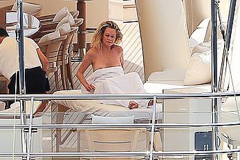 Melanie Griffith topless goes for a massage aboard a Yatch in Ibiza