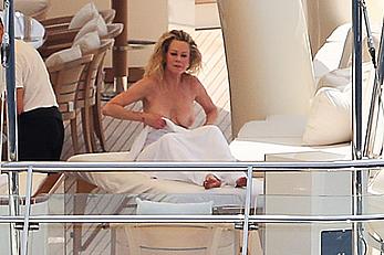 Melanie Griffith topless goes for a massage aboard a Yatch in Ibiza