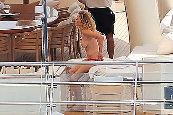 Melanie Griffith topless goes for a massage aboard a Yatch in Ibiza