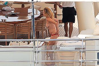 Melanie Griffith topless goes for a massage aboard a Yatch in Ibiza