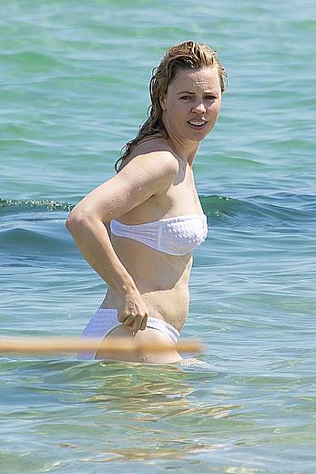 Melissa George pokies in white wet bikinii at a beach in St Tropez