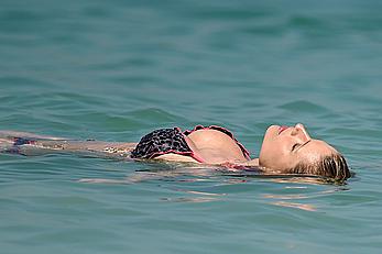 Michelle Hunziker in bikini at a beach