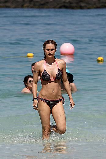 Michelle Hunziker in bikini at a beach