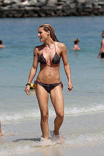 Michelle Hunziker in bikini at a beach