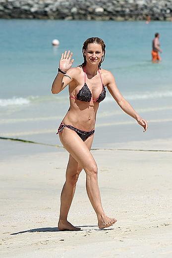 Michelle Hunziker in bikini at a beach