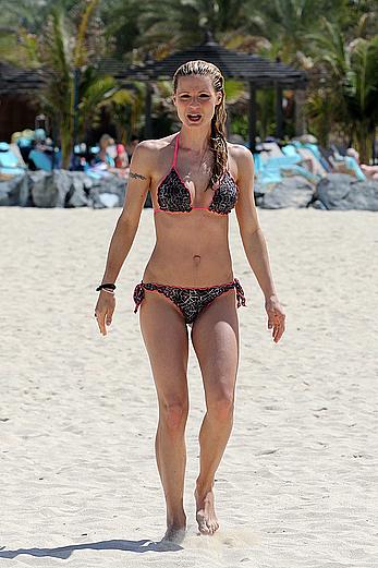 Michelle Hunziker in bikini at a beach